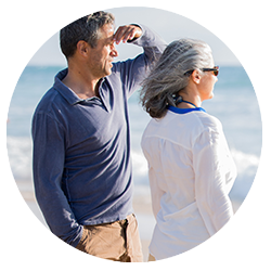 man and women looking at the ocean